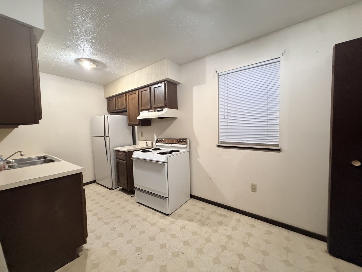 916 South 10th Street Herrin, IL 62948 - Photo 19 of 29 a kitchen with a sink appliances and cabinets
