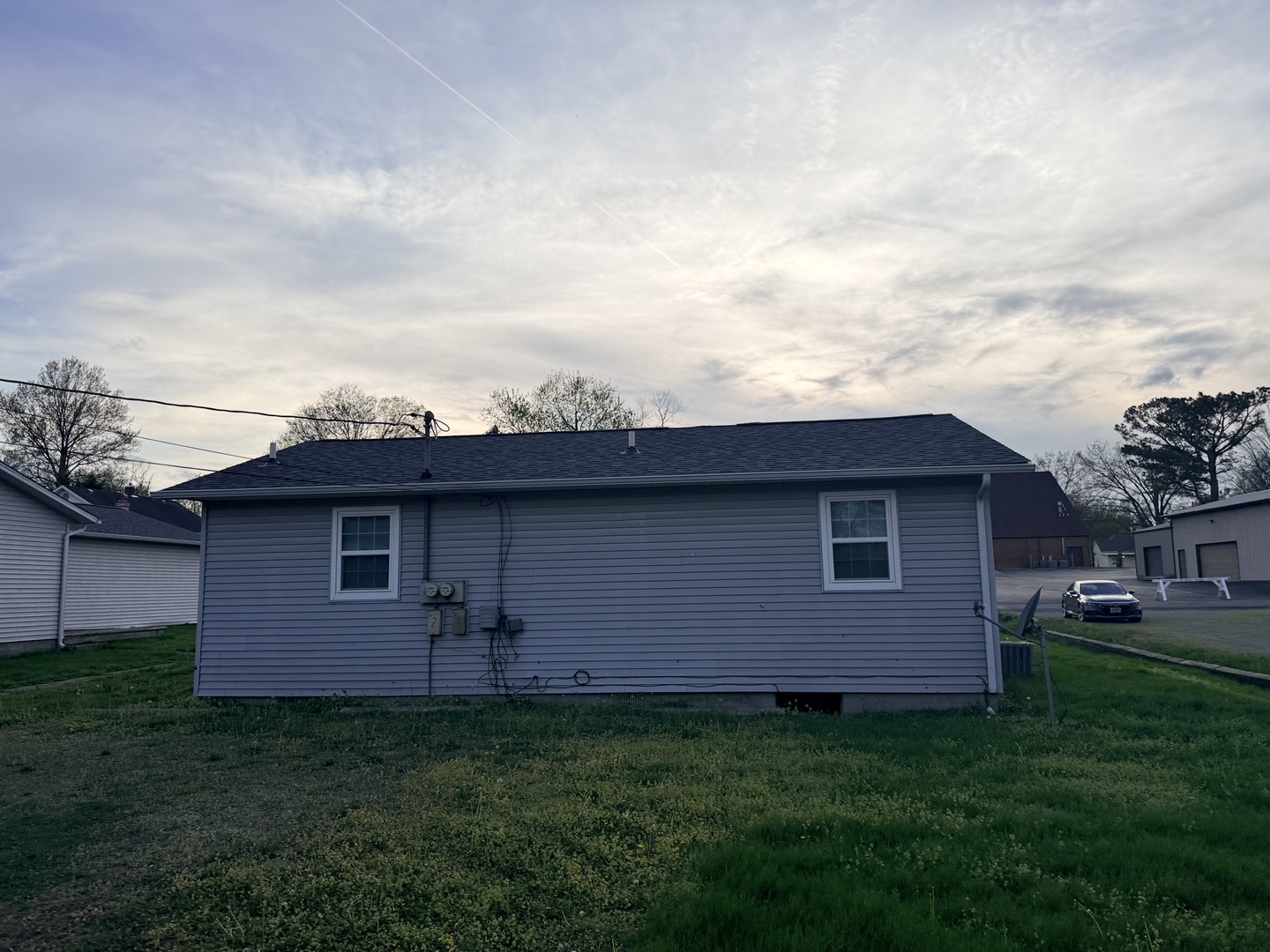 916 South 10th Street Herrin, IL 62948 - Photo 26 of 29 a backyard of a house with lots of green space and wooden fence