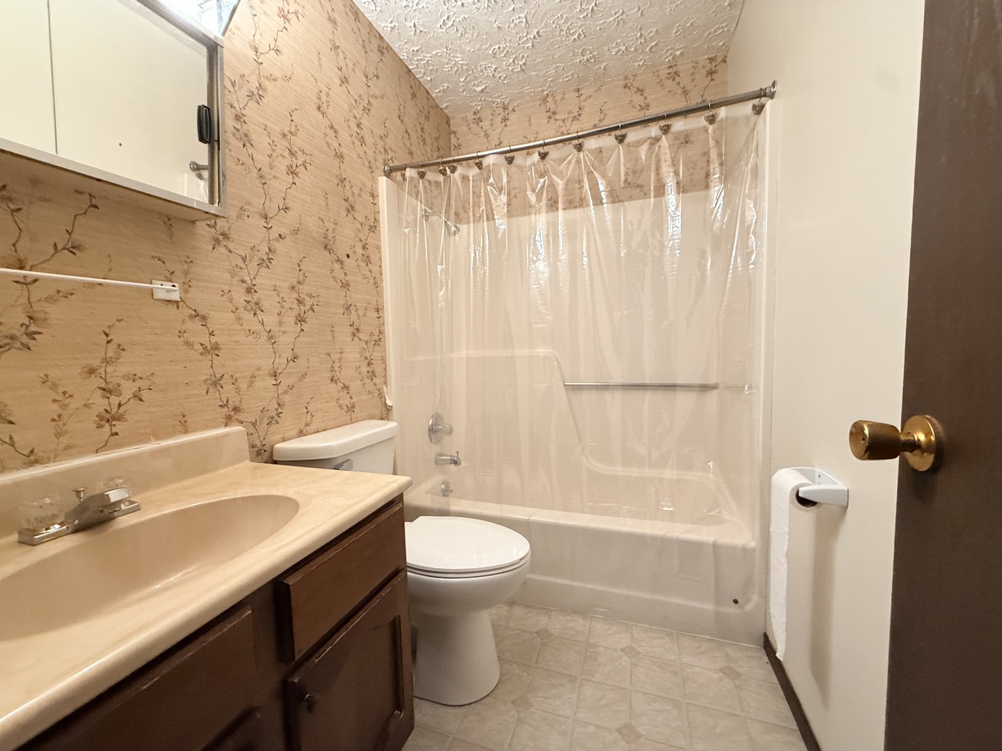 916 South 10th Street Herrin, IL 62948 - Photo 9 of 29 a bathroom with a sink a toilet and shower