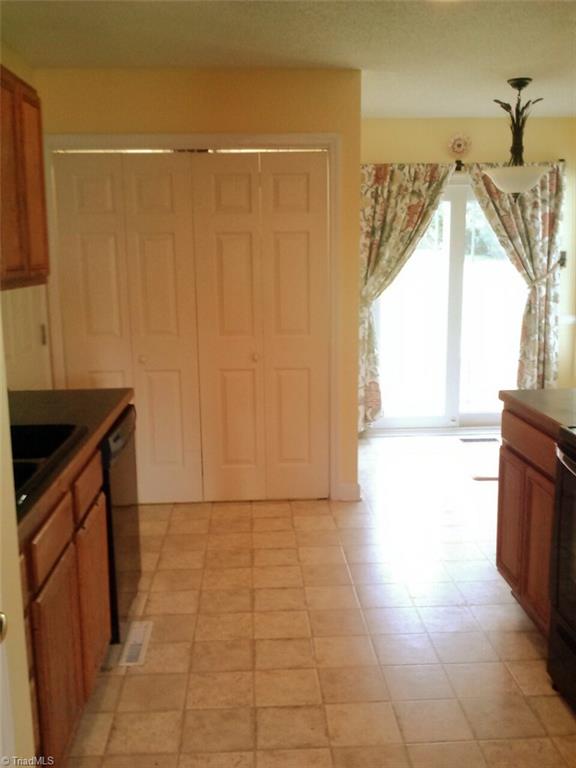 153 Winchester Road Advance, NC 27006 - Photo 14 of 20 Kitchen and breakfast room. Door leads to spacious deck.