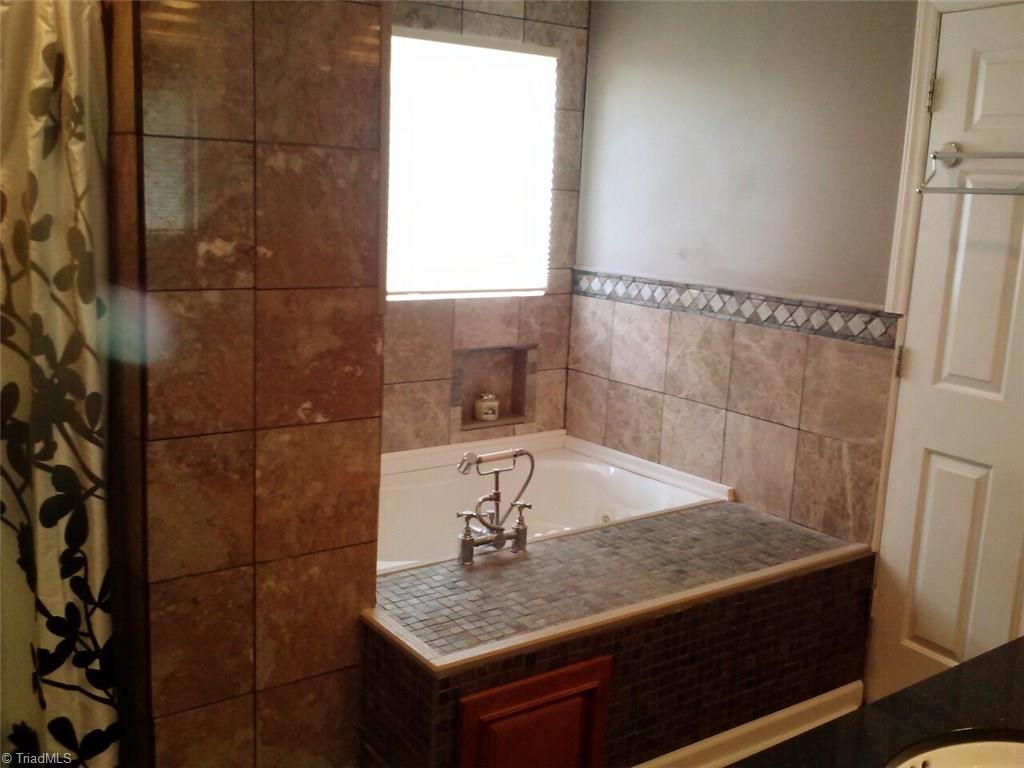 153 Winchester Road Advance, NC 27006 - Photo 18 of 20 Heated jetted tub with custom tile work.