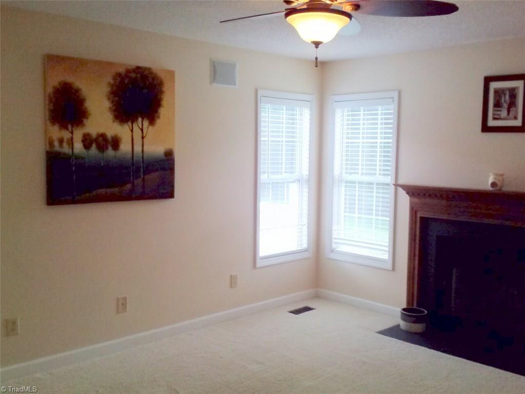 153 Winchester Road Advance, NC 27006 - Photo 8 of 20 Bright and airy great room with fireplace.