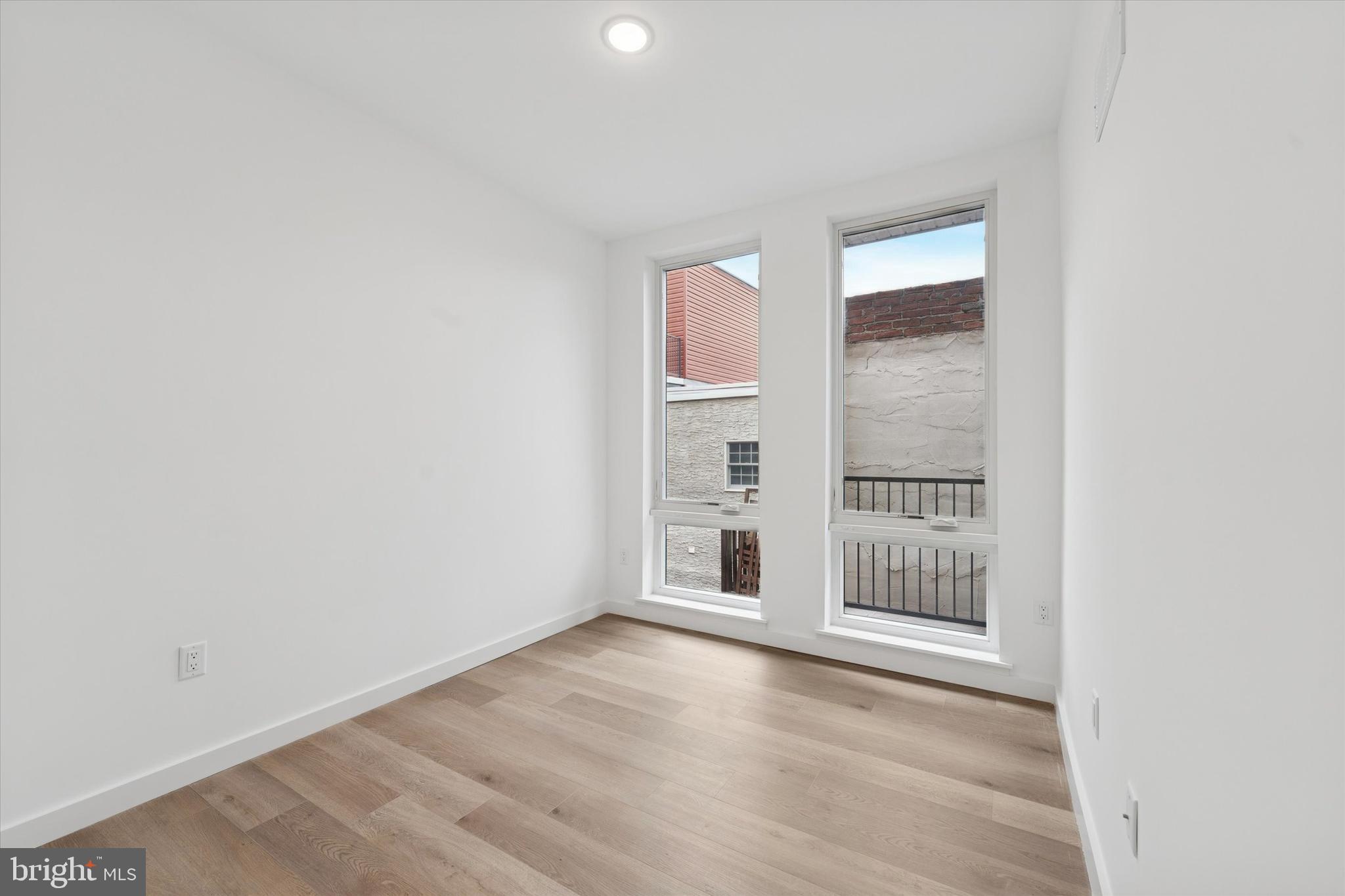 754 South 4th Street, Unit 202 Philadelphia, PA 19147 - Photo 4 of 10 an empty room with windows