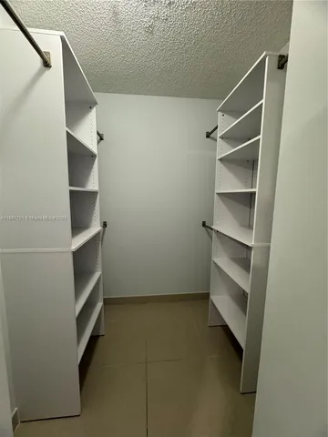 a view of an empty walk in closet