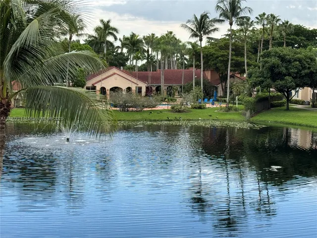 a view of a lake view with a garden and plants