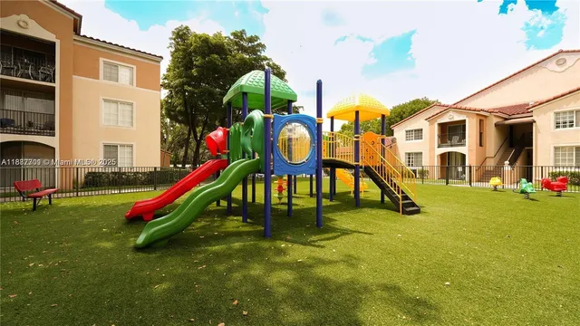 a view of a house with swimming pool and sitting area