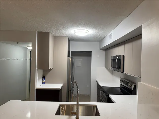 a bathroom with a bathtub sink and mirror