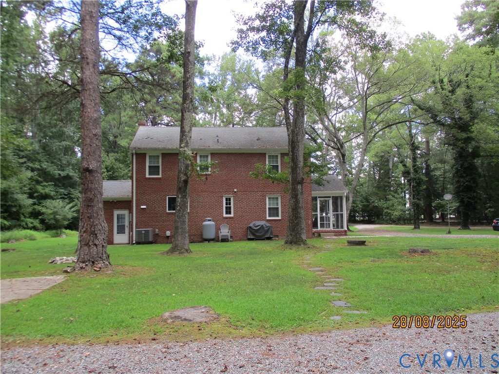 Undisclosed Address Hanover, VA 23069 - Photo 3 of 19 a front view of a house with a yard and trees