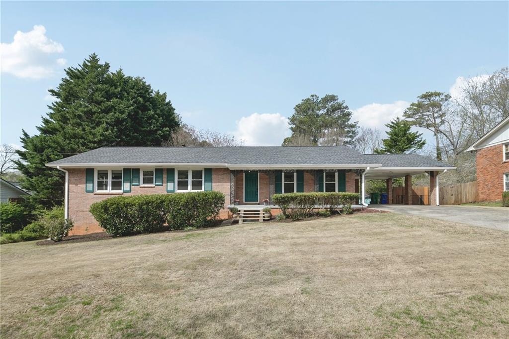3112 Galangale Way Atlanta, GA 30340 - Photo 1 of 28 a front view of a house with a garden