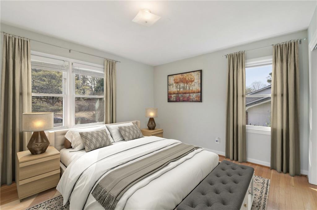 3112 Galangale Way Atlanta, GA 30340 - Photo 11 of 28 a bedroom with a bed and a large window