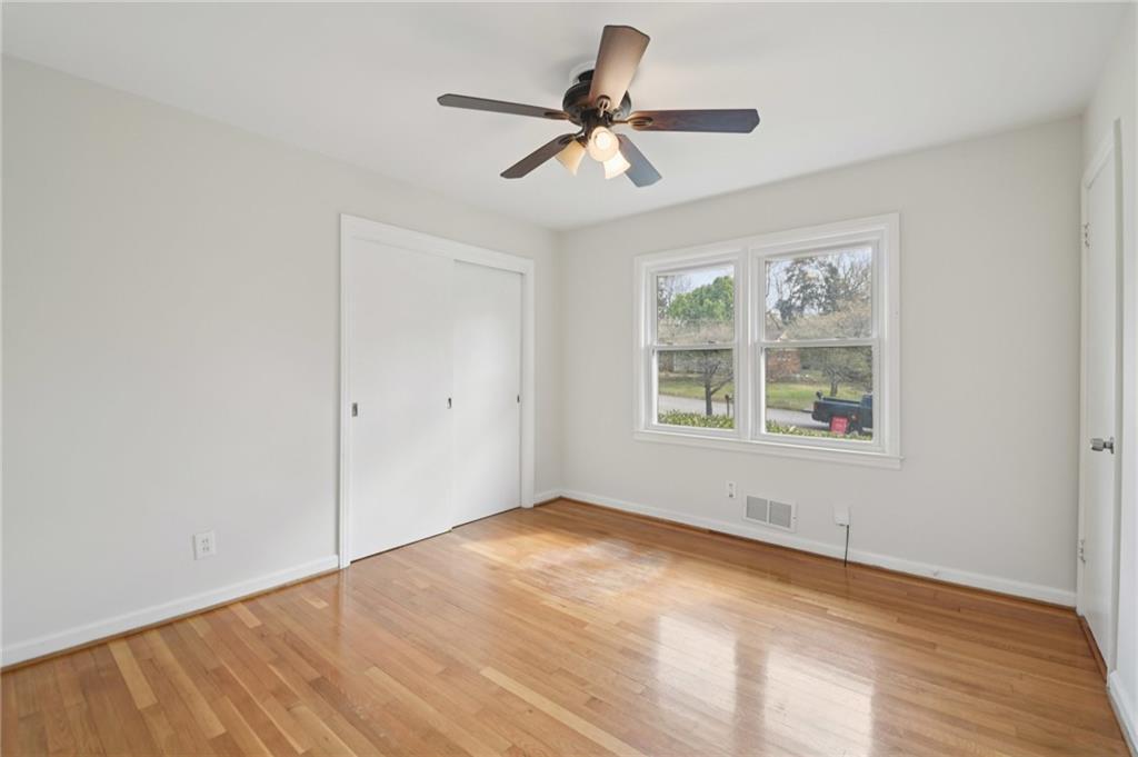 3112 Galangale Way Atlanta, GA 30340 - Photo 14 of 28 a view of empty room with wooden floor and fan