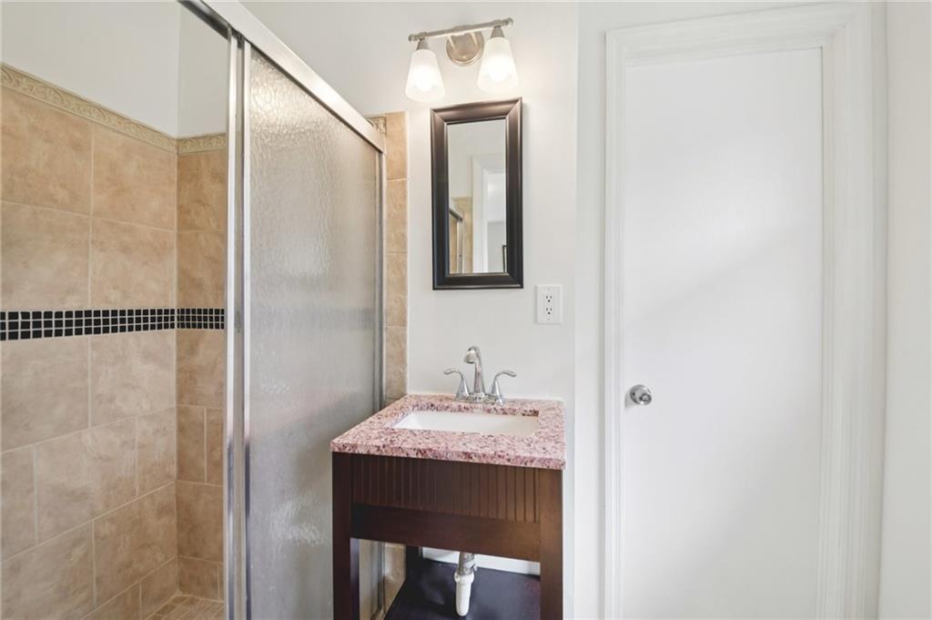 3112 Galangale Way Atlanta, GA 30340 - Photo 15 of 28 a bathroom with a sink and a mirror