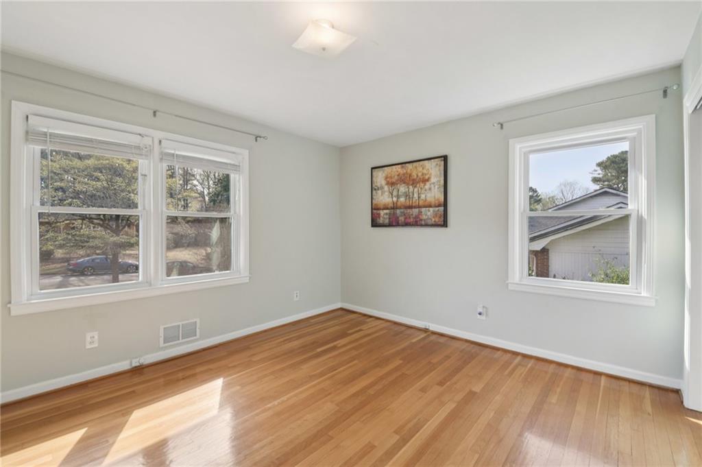 3112 Galangale Way Atlanta, GA 30340 - Photo 16 of 28 a view of empty room with wooden floor and fan