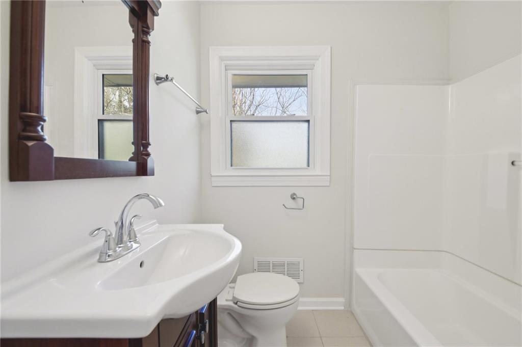 3112 Galangale Way Atlanta, GA 30340 - Photo 17 of 28 a bathroom with a sink toilet and shower
