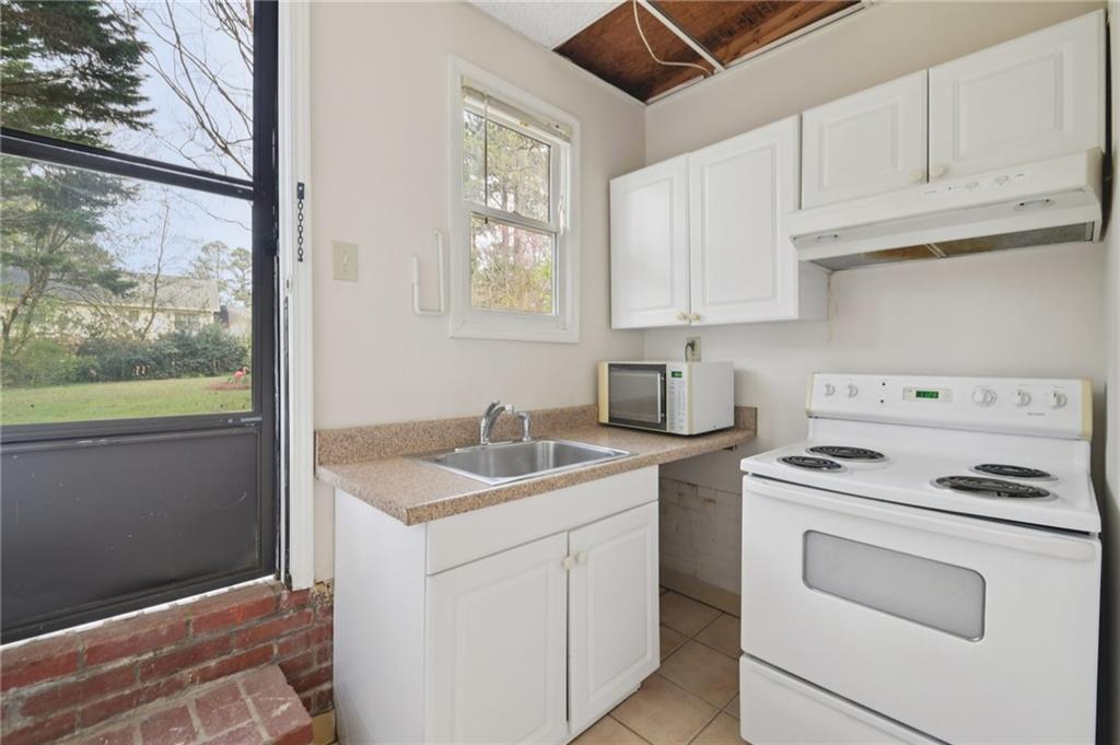 3112 Galangale Way Atlanta, GA 30340 - Photo 20 of 28 a kitchen with white cabinets appliances and a sink