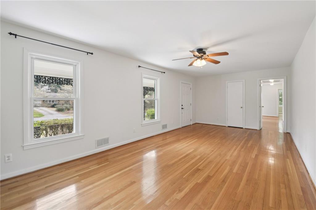 3112 Galangale Way Atlanta, GA 30340 - Photo 2 of 28 wooden floor in an empty room with a window