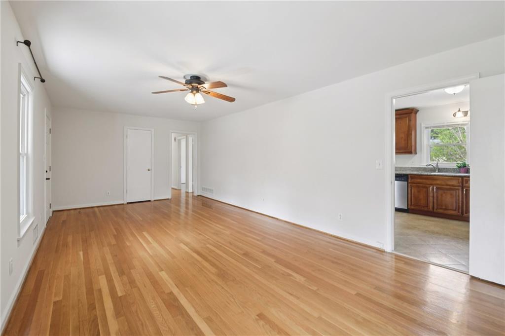3112 Galangale Way Atlanta, GA 30340 - Photo 3 of 28 a view of a room with wooden floor and a ceiling fan