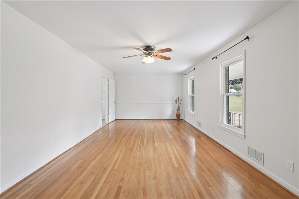 3112 Galangale Way Atlanta, GA 30340 - Photo 5 of 28 wooden floor in an empty room with a window