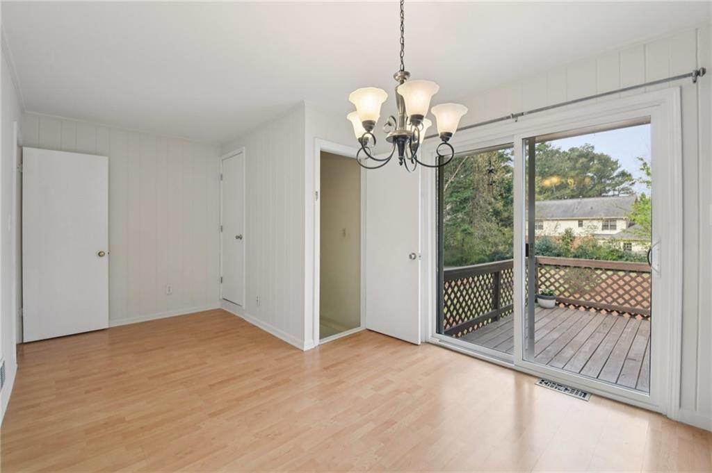 3112 Galangale Way Atlanta, GA 30340 - Photo 10 of 28 a view of a livingroom with a chandelier wooden floor and a chandelier