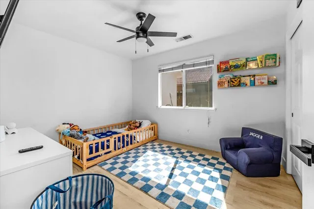 a bedroom with a bed and a window