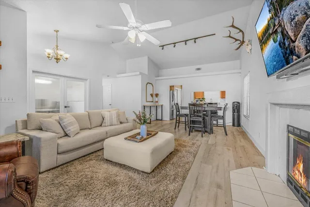 a workspace with furniture and a chandelier