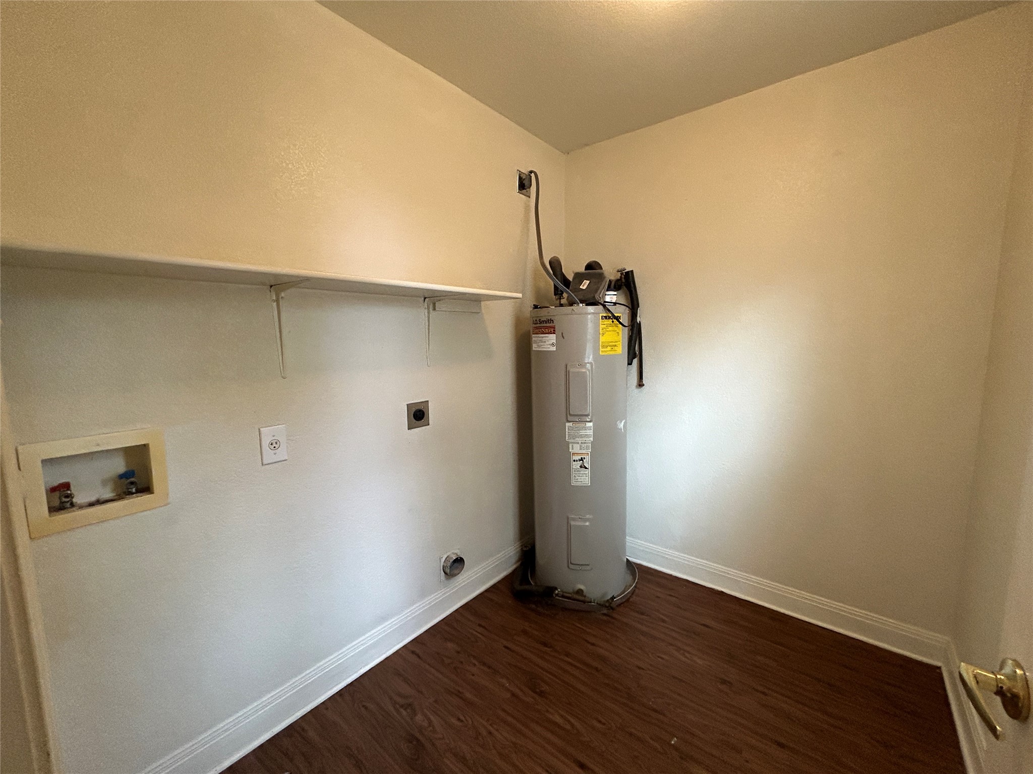 1909 Tranquilo Trail Austin, TX 78744 - Photo 8 of 14 utility room upstairs by bedrooms