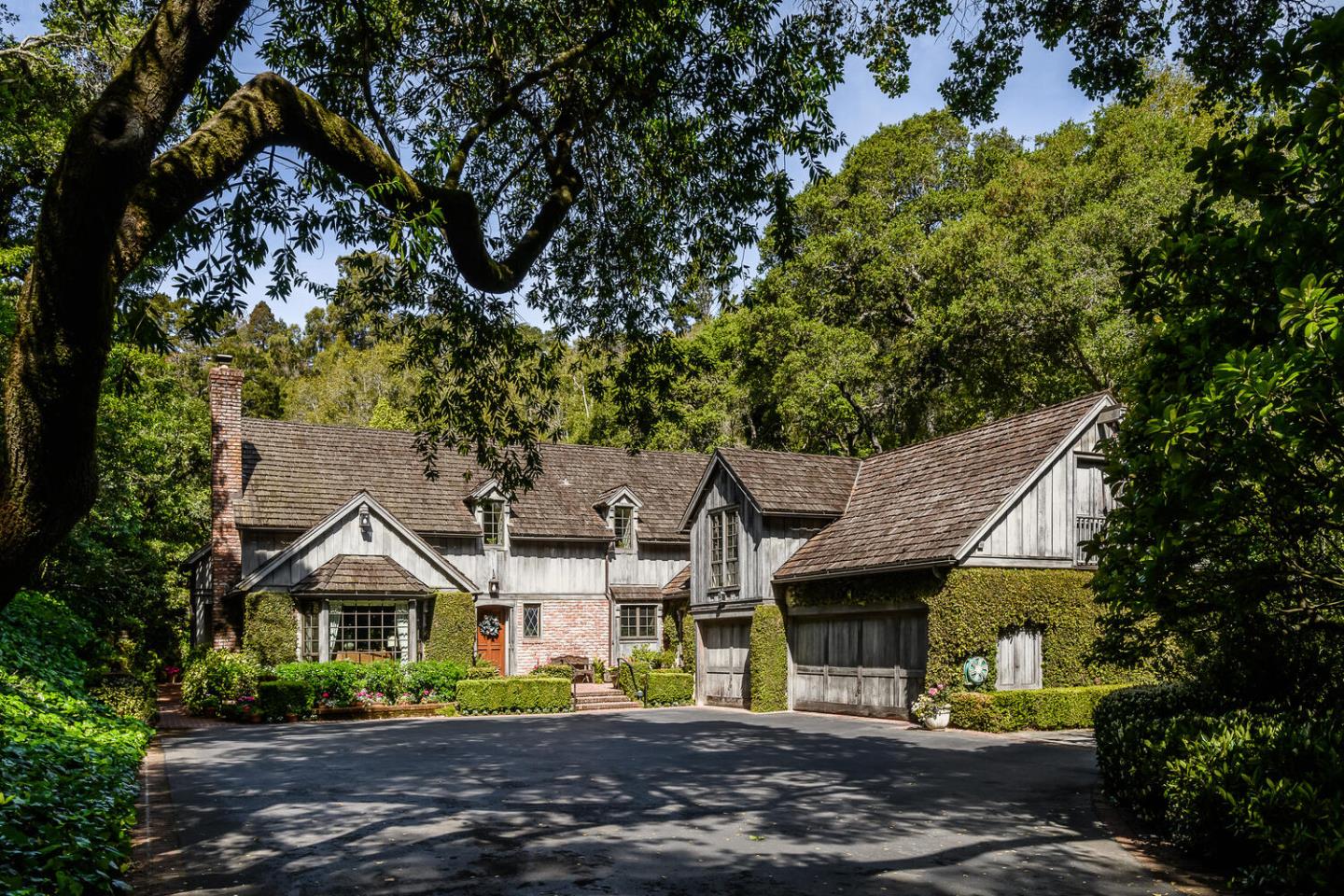 100 Robin Road Hillsborough, CA 94010 - Photo 1 of 90 a front view of a house with a garden