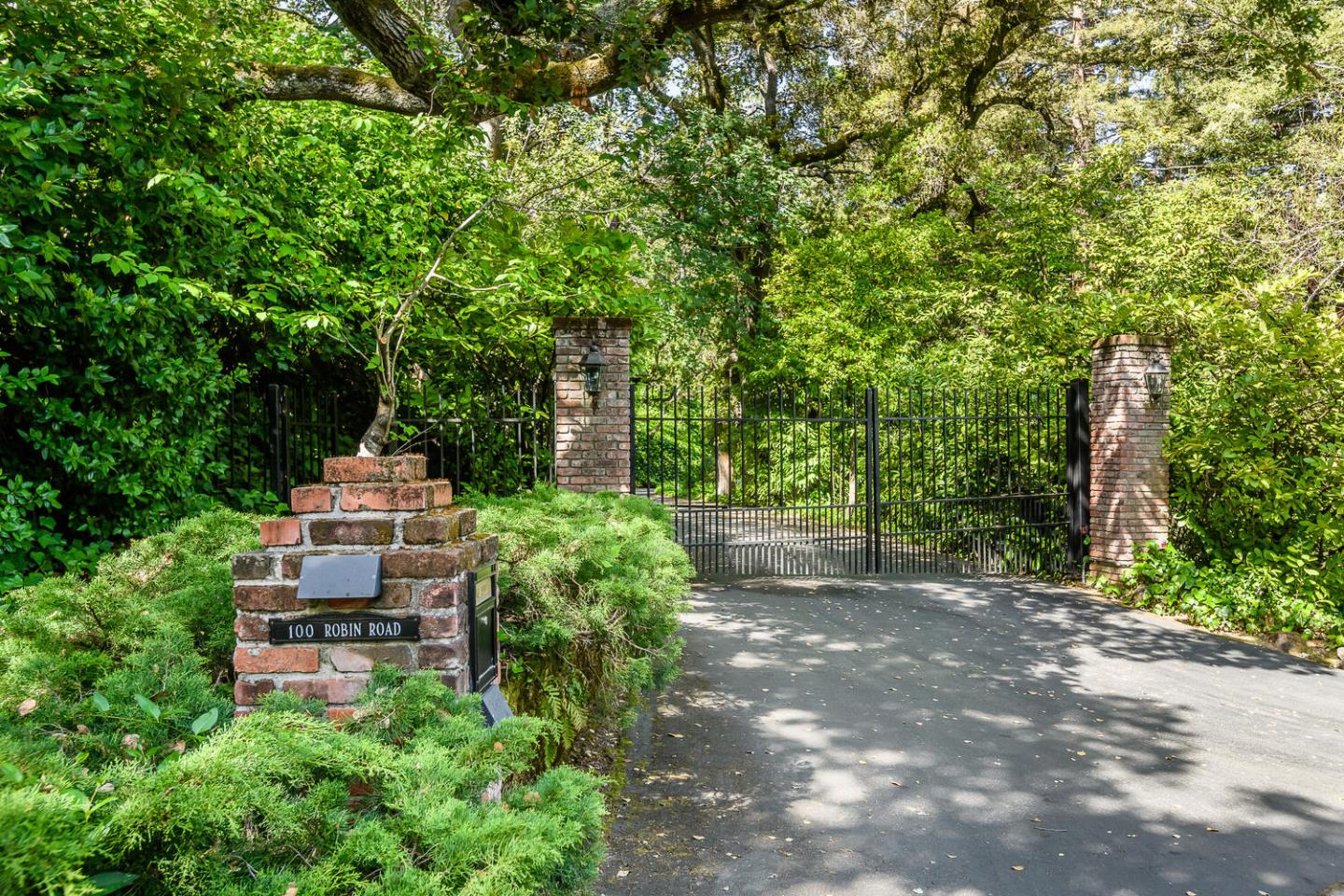100 Robin Road Hillsborough, CA 94010 - Photo 2 of 90 a backyard of a house with lots of green space