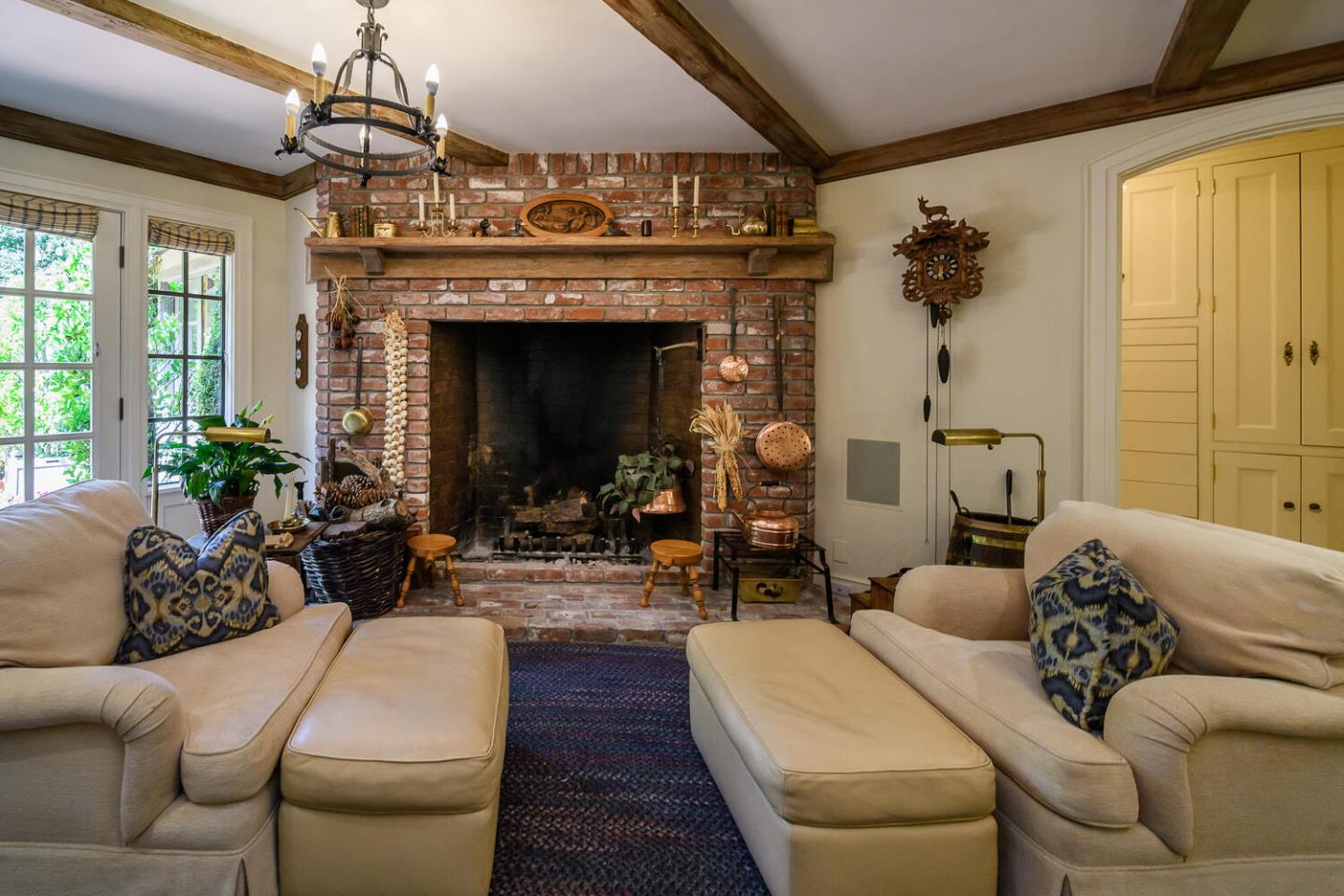 100 Robin Road Hillsborough, CA 94010 - Photo 19 of 90 a living room with furniture and a fireplace