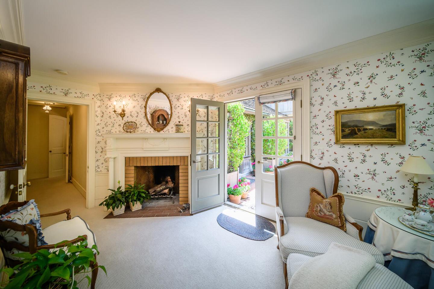 100 Robin Road Hillsborough, CA 94010 - Photo 23 of 90 a living room with furniture and a fireplace