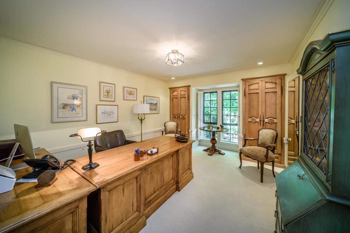 100 Robin Road Hillsborough, CA 94010 - Photo 29 of 90 a living room with furniture a flat screen tv and a large window