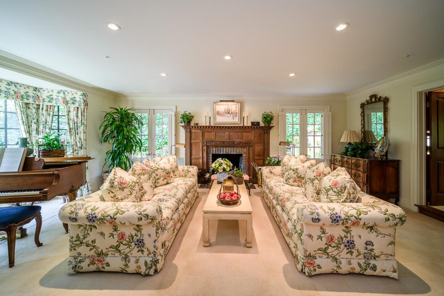 100 Robin Road Hillsborough, CA 94010 - Photo 5 of 90 a living room with furniture large window and a fireplace