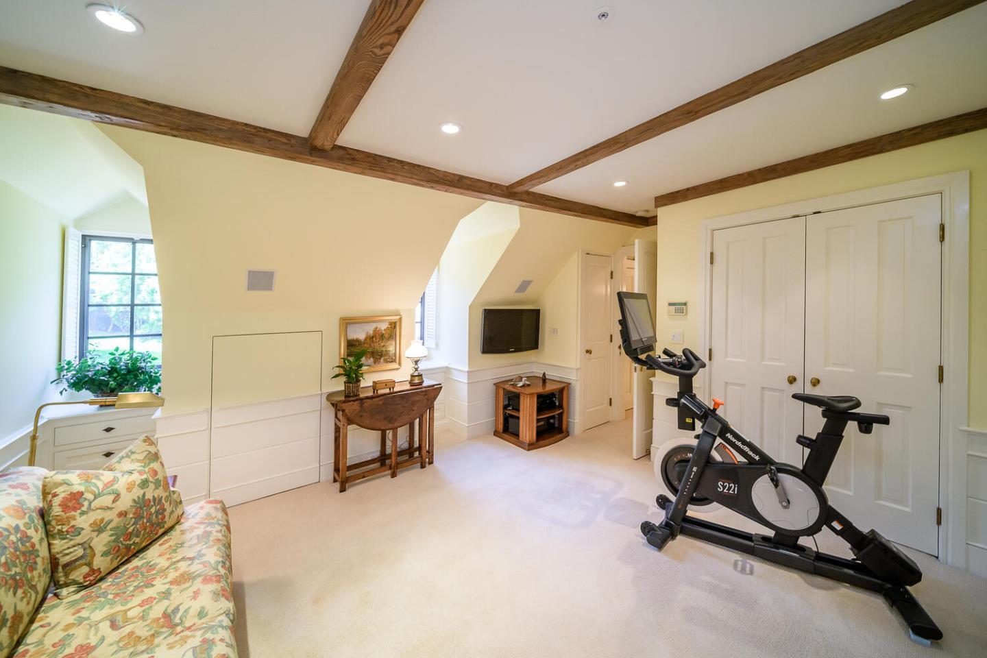 100 Robin Road Hillsborough, CA 94010 - Photo 44 of 90 a view of a livingroom with workspace and a window