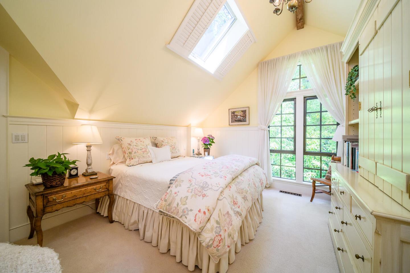 100 Robin Road Hillsborough, CA 94010 - Photo 46 of 90 a bedroom with a bed table flowerpot and a window