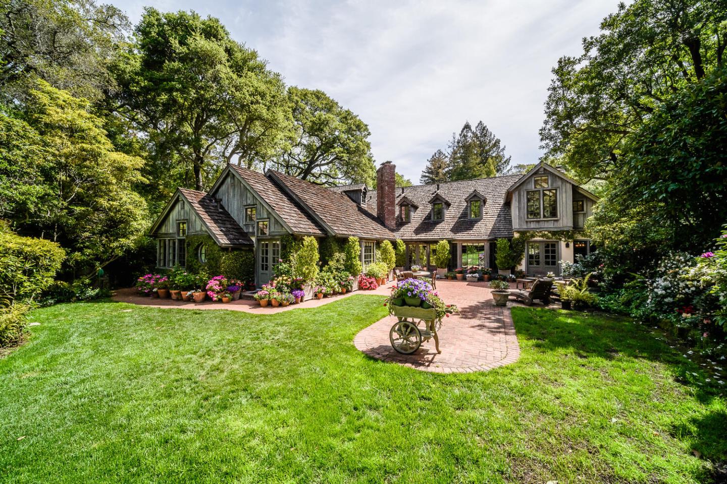 100 Robin Road Hillsborough, CA 94010 - Photo 57 of 90 a front view of a house with swimming pool garden and patio
