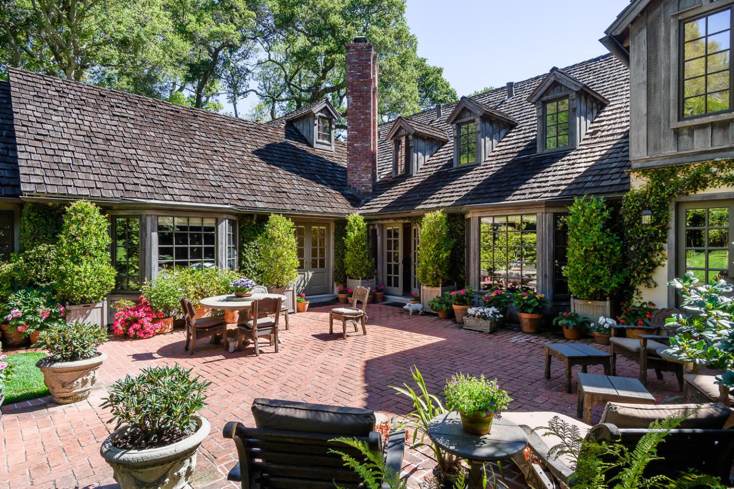 100 Robin Road Hillsborough, CA 94010 - Photo 61 of 90 a view of a patio with furniture and a potted plants