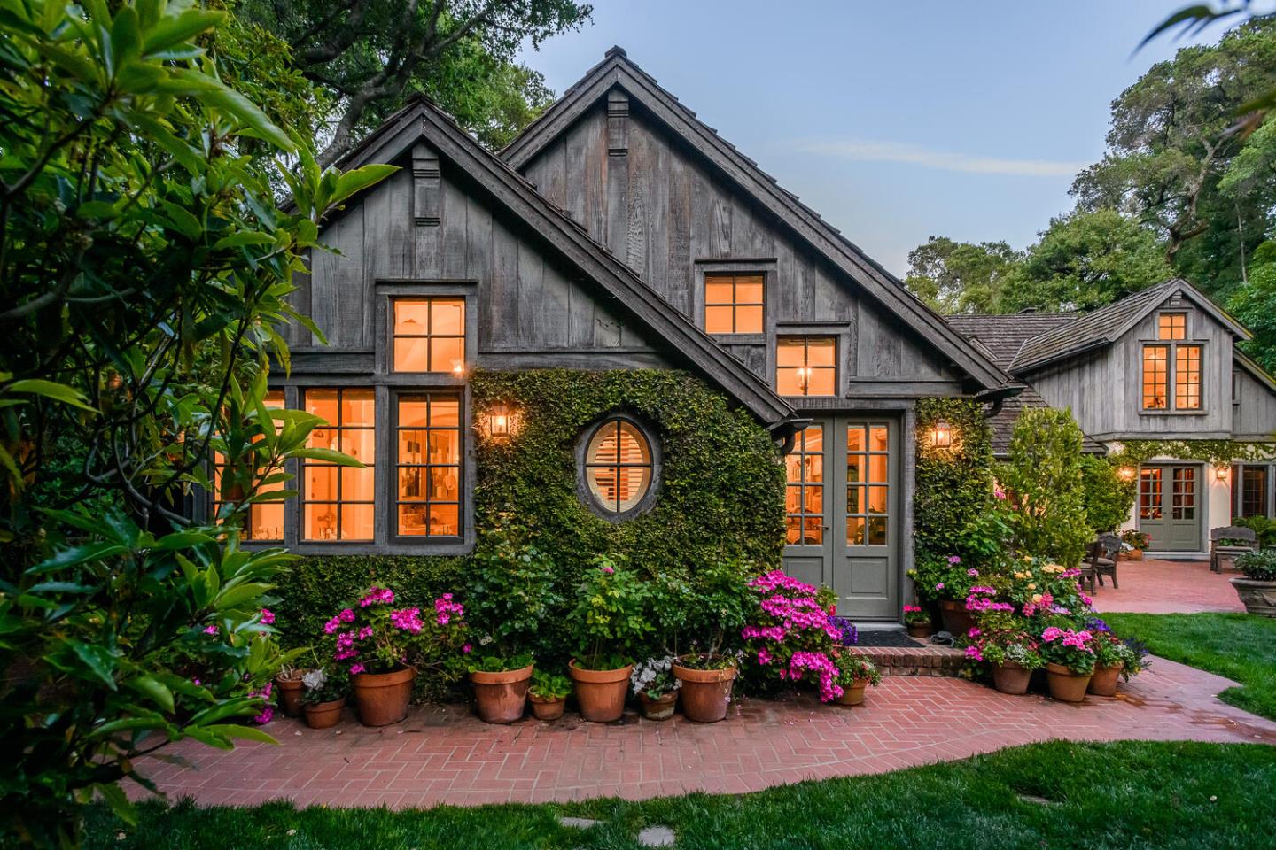 100 Robin Road Hillsborough, CA 94010 - Photo 74 of 90 a front view of a house with a yard and outdoor seating