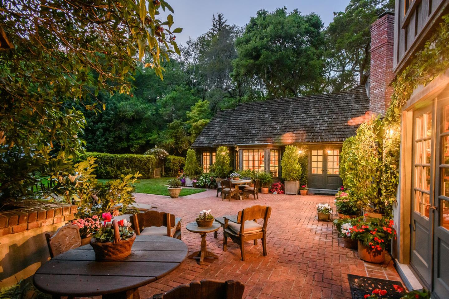 100 Robin Road Hillsborough, CA 94010 - Photo 75 of 90 a view of a patio with table and chairs potted plants and large tree