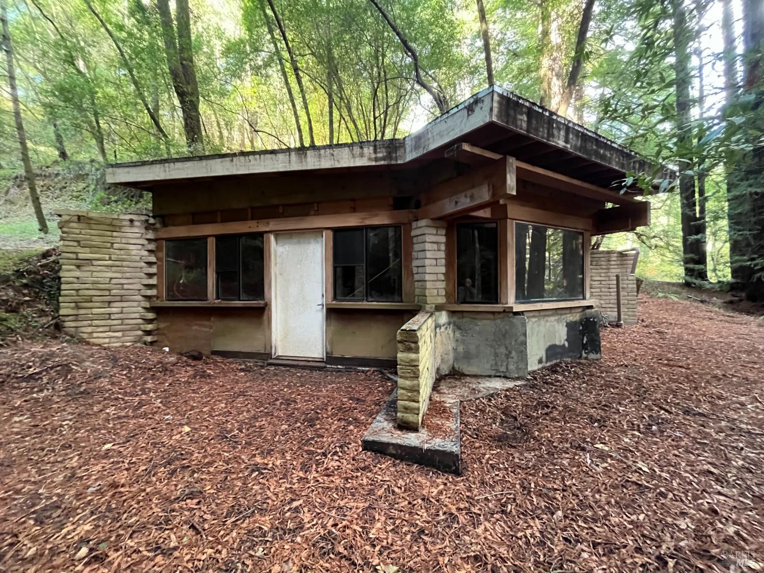 1355 Nicasio Valley Road Nicasio, CA 94946 - Photo 14 of 33 a front view of a house with a garden