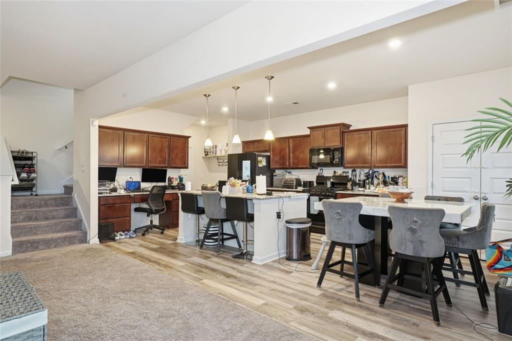 223 Malbone Street Southwest Cartersville, GA 30120 - Photo 11 of 38 a view of a dining area with furniture