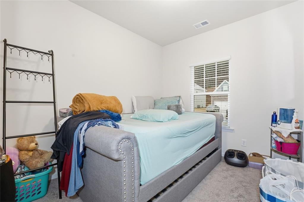 223 Malbone Street Southwest Cartersville, GA 30120 - Photo 16 of 38 a bedroom with a bed and a window