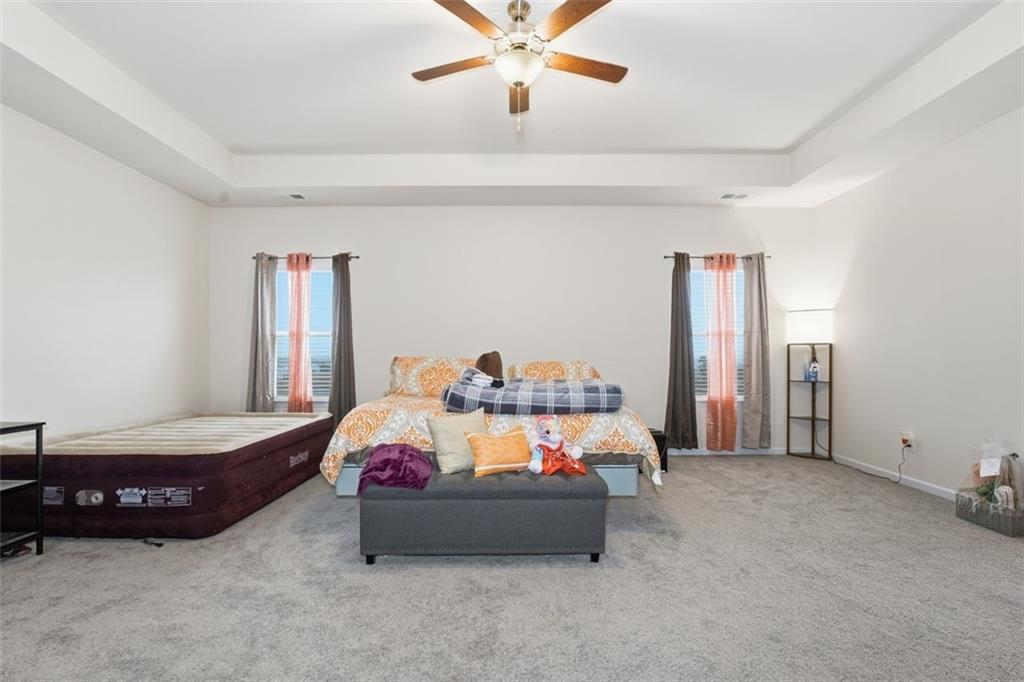 223 Malbone Street Southwest Cartersville, GA 30120 - Photo 20 of 38 a bedroom with a bed and window