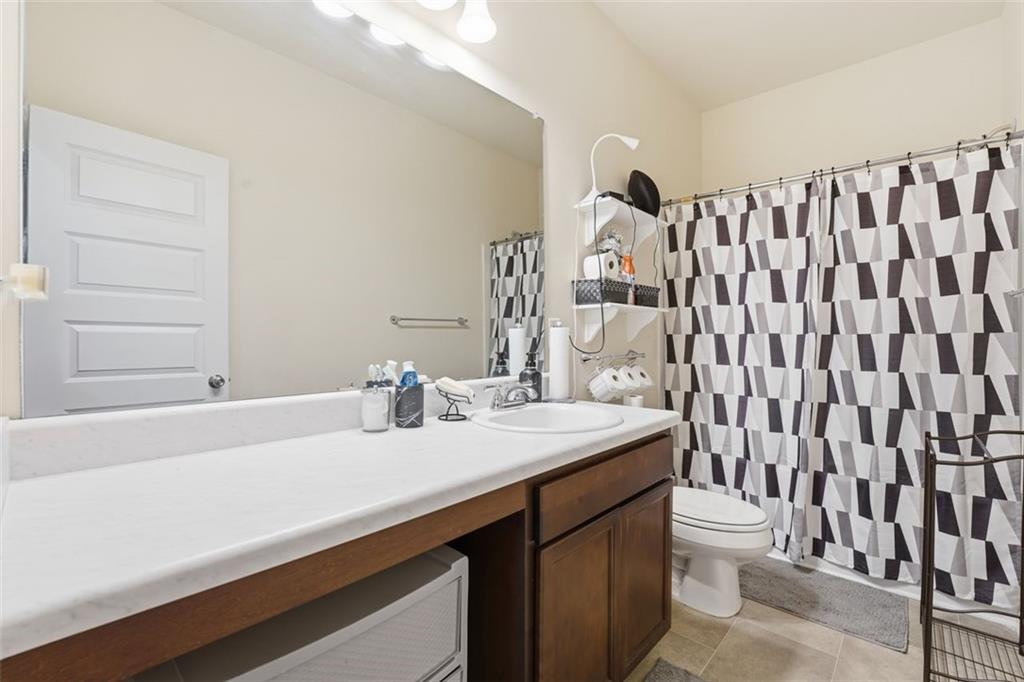 223 Malbone Street Southwest Cartersville, GA 30120 - Photo 22 of 38 a bathroom with a sink and a mirror