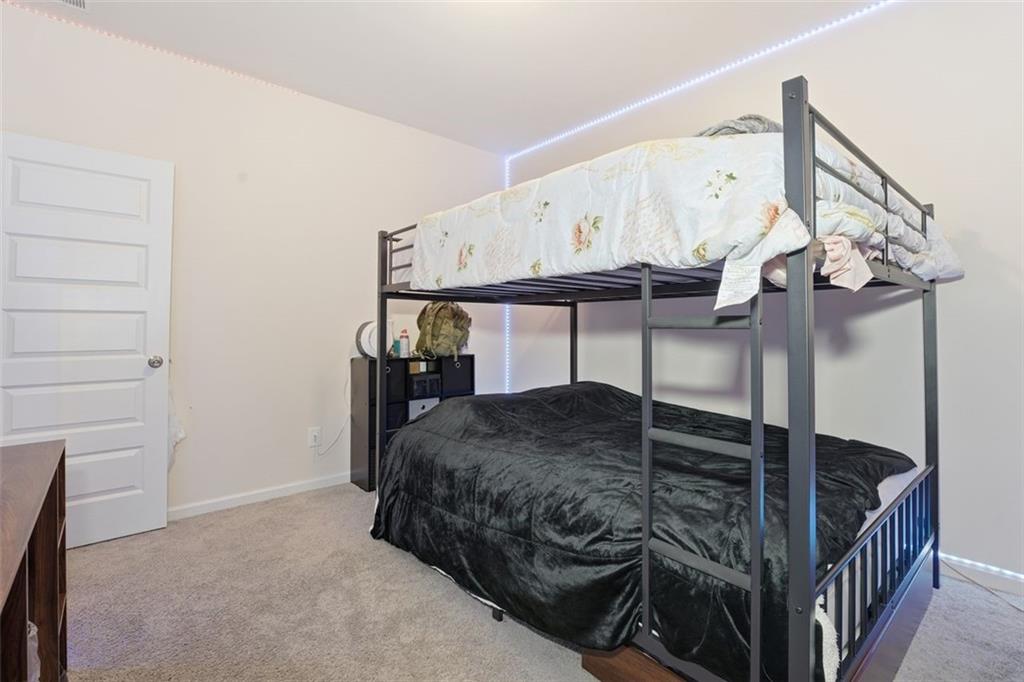 223 Malbone Street Southwest Cartersville, GA 30120 - Photo 23 of 38 a bedroom with bed and closet