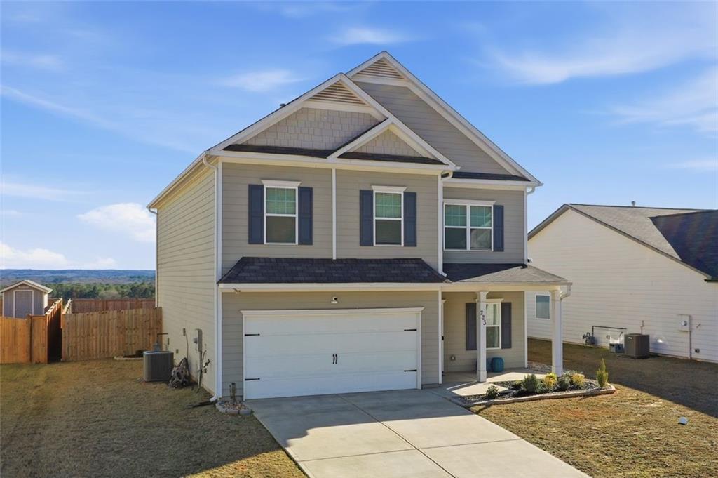 223 Malbone Street Southwest Cartersville, GA 30120 - Photo 3 of 38 a front view of a house with parking area