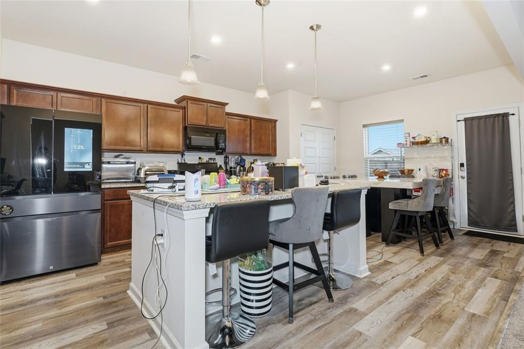 223 Malbone Street Southwest Cartersville, GA 30120 - Photo 8 of 38 a kitchen with a sink appliances and cabinets