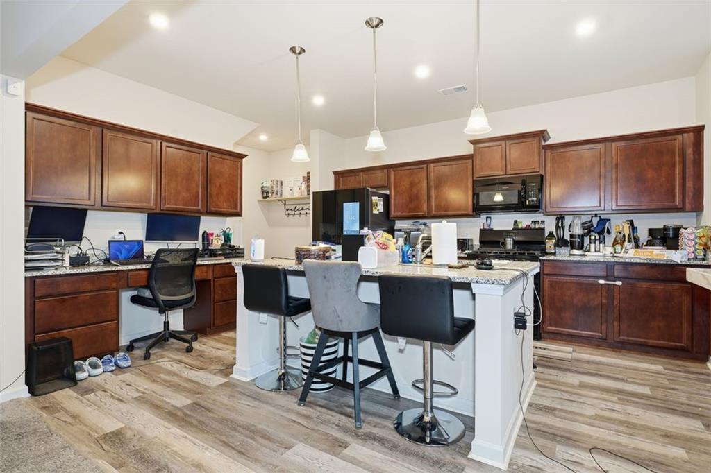 223 Malbone Street Southwest Cartersville, GA 30120 - Photo 9 of 38 a kitchen with a sink cabinets and window