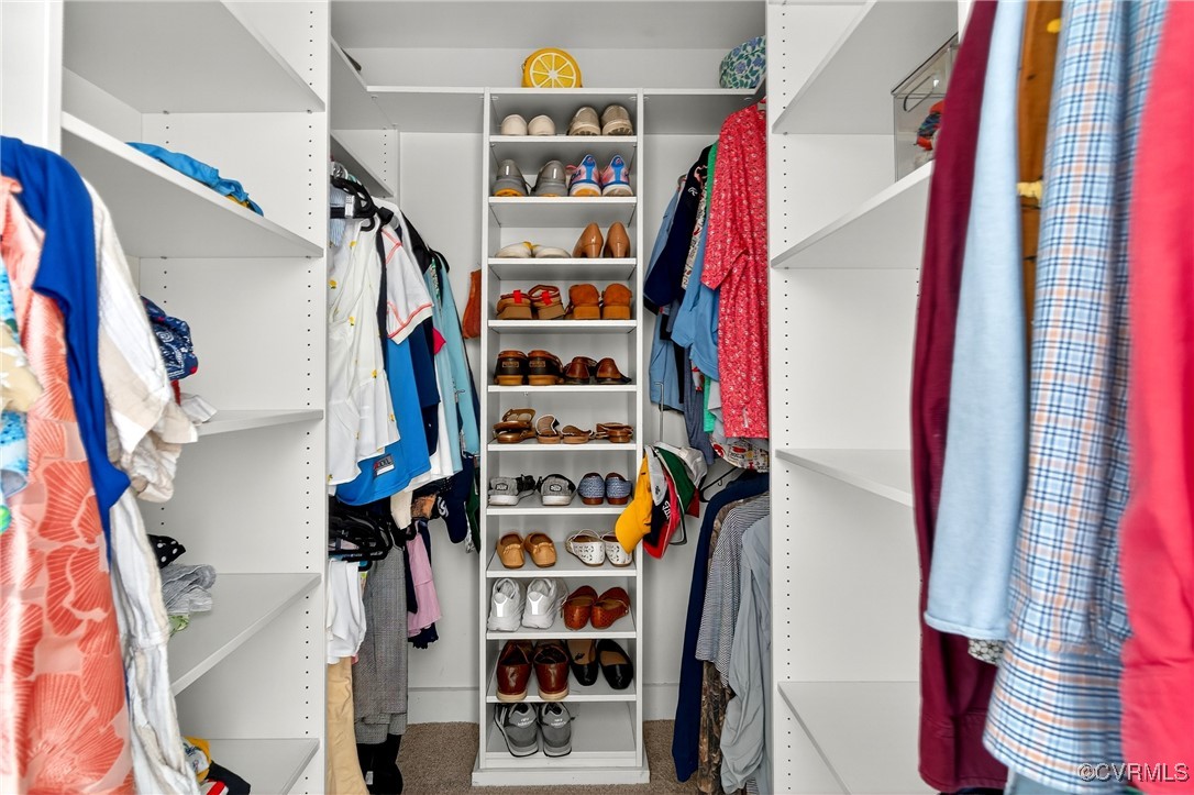 3921 Timber Ridge Road Midlothian, VA 23112 - Photo 25 of 47 a view of walk in closet with clothes and shoes
