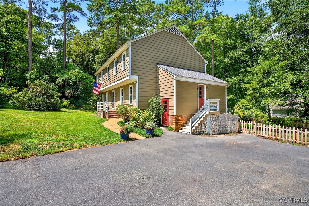 3921 Timber Ridge Road Midlothian, VA 23112 - Photo 3 of 47 a view of a house with backyard and garden
