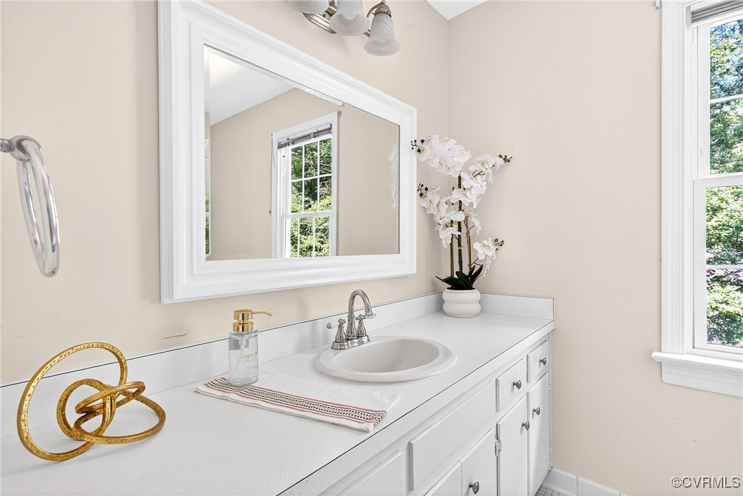3921 Timber Ridge Road Midlothian, VA 23112 - Photo 33 of 47 a bathroom with a sink and a mirror